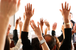 Bus Crowd With Raised Hands